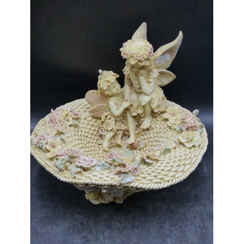 144 - Fairies sat in Bonnet with Flowers