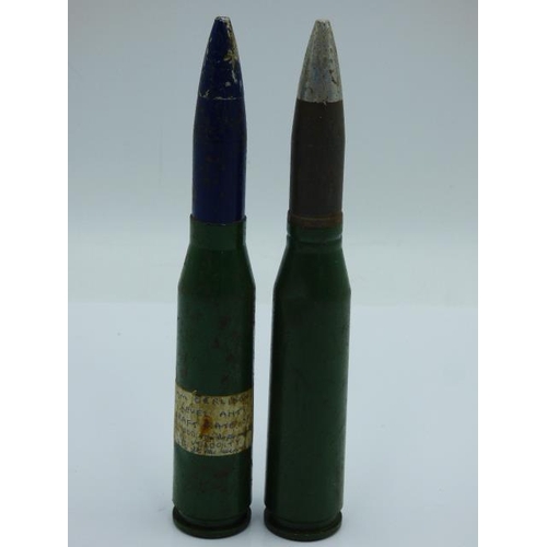 109 - Two Inert shells with green bases