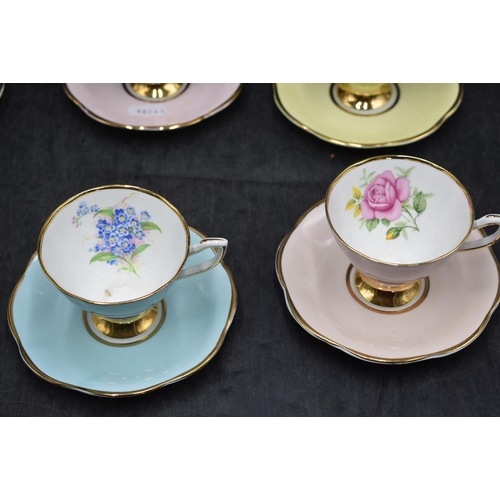 49 - Clare bone china harlequin cups and saucers, each with a different floral spray to cup interior