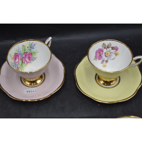 49 - Clare bone china harlequin cups and saucers, each with a different floral spray to cup interior