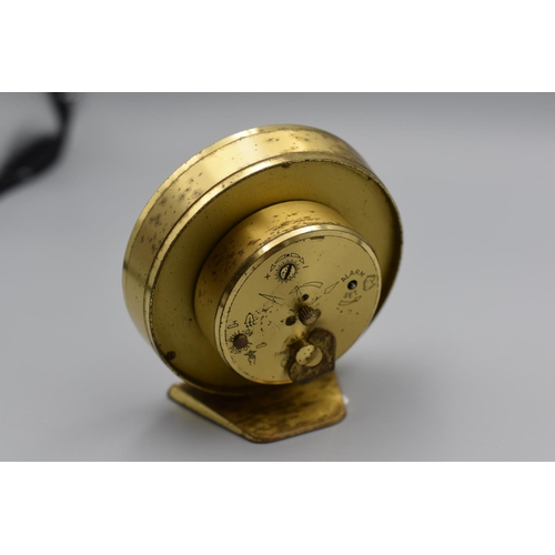 84 - Swiza 7 Jewel Brass Cased Circular Alarm Clock