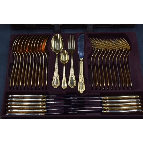 187 - A Cased 73 Piece Bestecke SBS Solingen 24ct gold plated cutlery set laid on two trays with original ... 