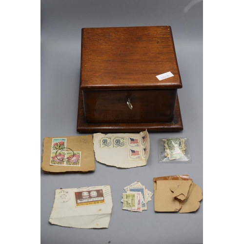 244 - Wooden Lockable Box complete with Selection of Stamps