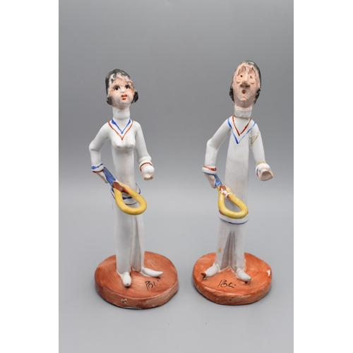 231 - Two Ceramic Sports Themed Statues signed 