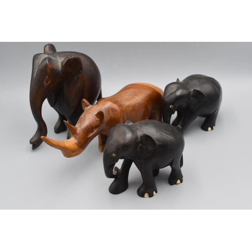 149 - Four Mid Century Teak and Ebony Animal Figures