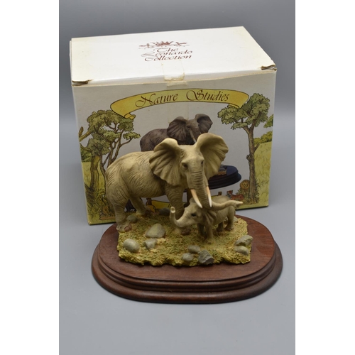 150 - African Elephant Ceramic Figure Mounted on Wooden Plinth with Presentation Box