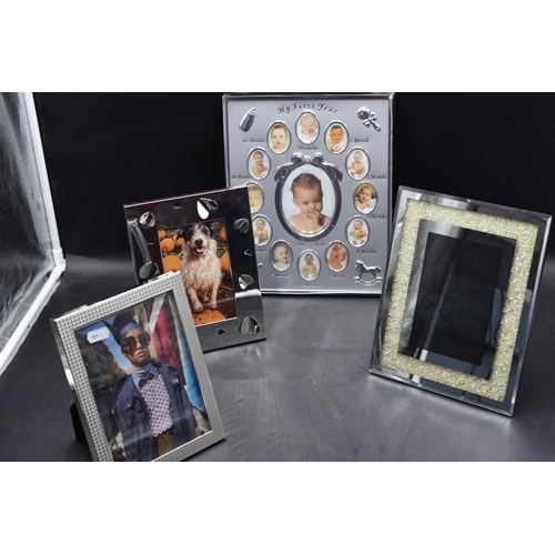 282 - 4 x Chrome plated photo frames including a 'My First Year' baby frame.