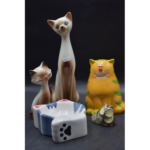 285 - Collection of ceramic cat related pieces including; 2 x glazed Siamese figures, 1 x cat money box, 1... 