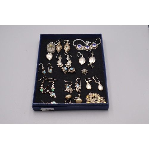 106 - Selection of Silver Pendants, Bracelet and Earrings