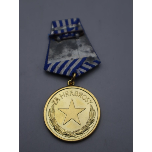 102 - Yugoslav Military Medal Complete with Ribbon