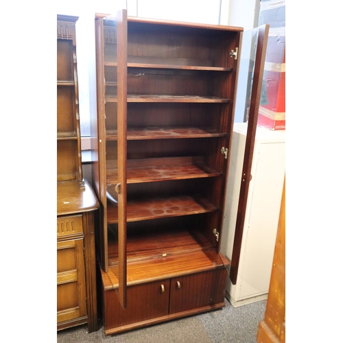 395 - Tall Glazed Book Case With Cupboard . Measures   80cm wide x  56cm deep x  180cm tall