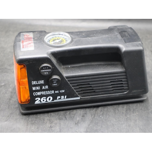 424 - Electric Portable Air Compressor & Torch Combination. Cigarette lighter connection missing.