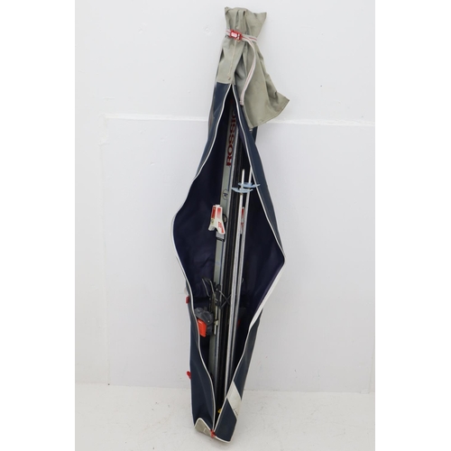 377 - Pair of Salomon multi sized boot skis and poles. Ski size approx 165cm.