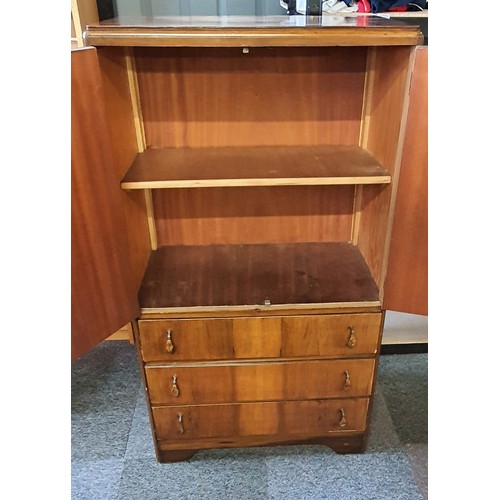 25 - A Two Door, 3 Drawer Tallboy . It is 54 inches tall, x 30 wide and 17 deep approx .
