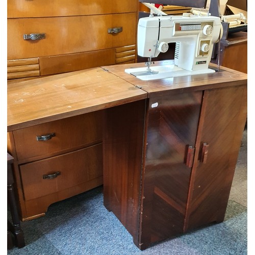36 - A New Home Electric Sewing Machine in a Singer Treadle Cabinet