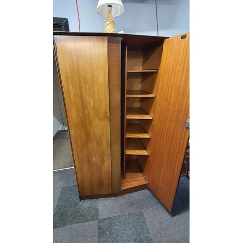 41 - A 1960's Symbol Furniture Bedroom Suite Comprising of Chest of Drawers, Two Dressing Tables and a Sh... 