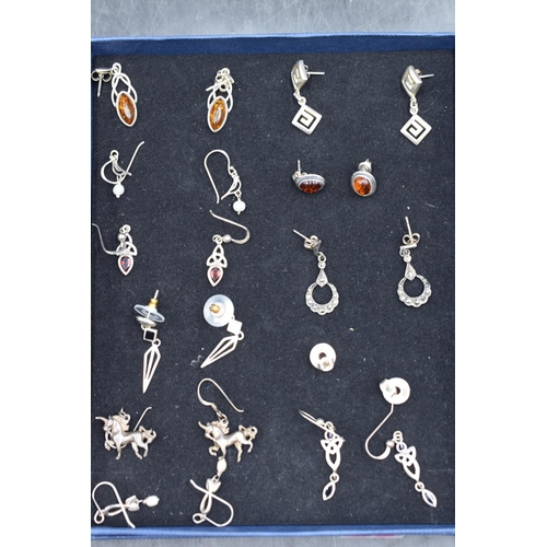 64 - Eleven Pairs of Silver 925 Earrings including Amber, Unicorn and More