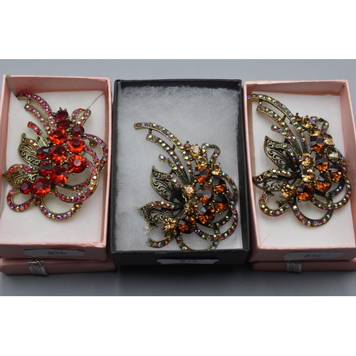 72 - Three Diamante Jewelled Floral Brooches complete with Original Boxes