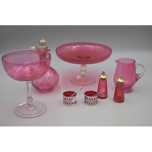 182 - Eight Pieces of Cranberry Glass Includes Fruit Bowl on Clear Pedestal, Cruets, Vinegar Jug, Large Gl... 