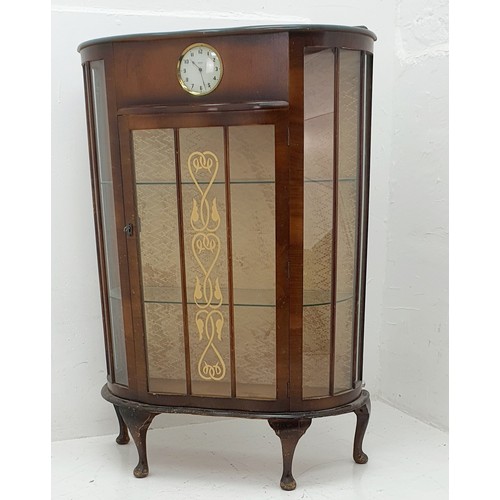 454a - A Sureline Display Cabinet with built in Smiths 30 hour clock. Made by George Serlin and Sons London... 