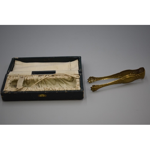 55 - Pair of Art Nouveau 18ct Gold Plated Tongs with Lions Claw feet Complete with Original Box