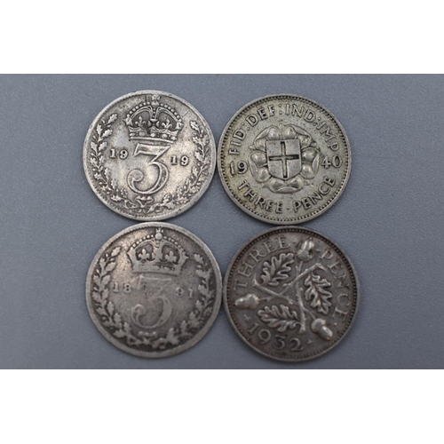 57 - Selection of 4 Silver Victoria, George V, and George VI Three Pence Coins dating From 1891