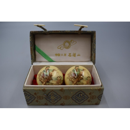 67 - Two Chinese Health Balls in Case