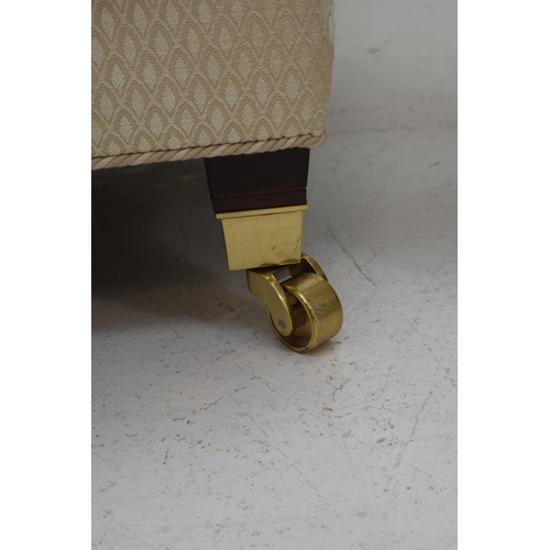 450 - Matching Pair of Cream Arm-Chairs on Four Brass Castors