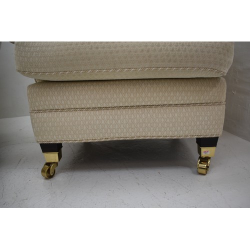 450 - Matching Pair of Cream Arm-Chairs on Four Brass Castors