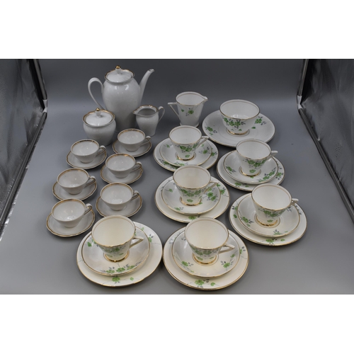 212 - Phoenix white patterned bone china six piece tea set and six piece white/gold coffee set with coffee... 