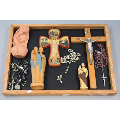 121 - A Tray of Religious Items to Include Jesus on The Cross, Rosary Beads and Other