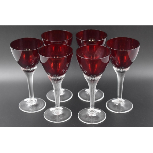 129 - Set of six ruby red twisted stem wine glasses.