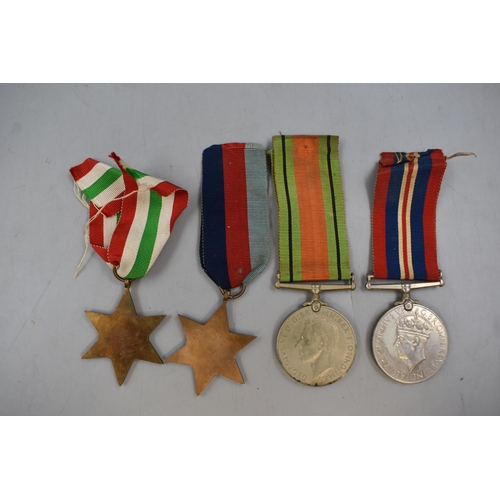 113 - Four WWII Medals, Includes 1939-45 Star, Italy Star, War Medal and Defense Medal. All With Original ... 