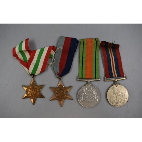 113 - Four WWII Medals, Includes 1939-45 Star, Italy Star, War Medal and Defense Medal. All With Original ... 