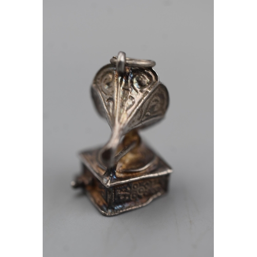 62 - An Unmarked Silver Gramophone Charm.