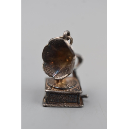 62 - An Unmarked Silver Gramophone Charm.