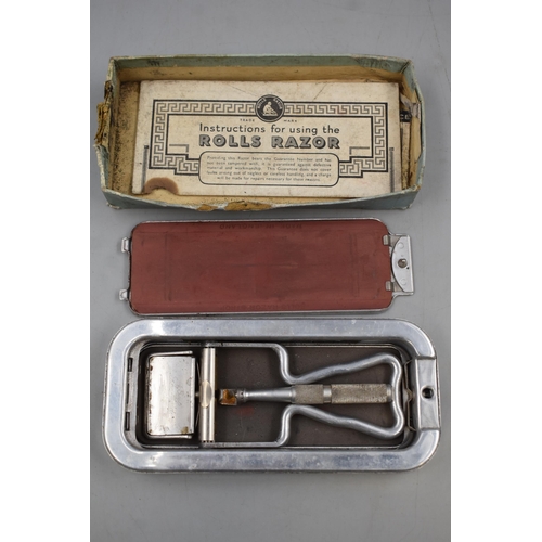 68 - Two Cut Throat Razors and a Rolls Razor in Case