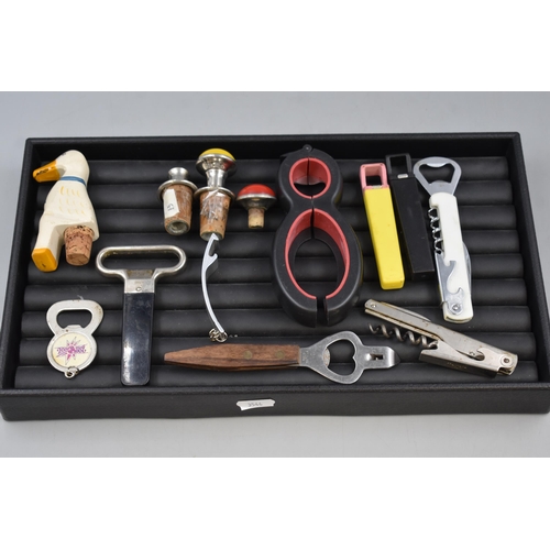 76 - A Tray Containing A Selection Of Bottle Openers and Stoppers.