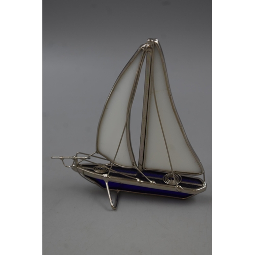 87 - A Metal and Glass Boat Figurine, With Cobalt and Opaque Glass. Approx 5.5