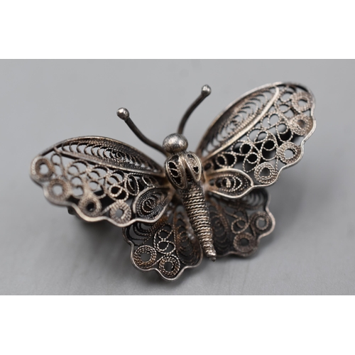 66 - Two Silver Brooches to include Filigree butterfly and Flower