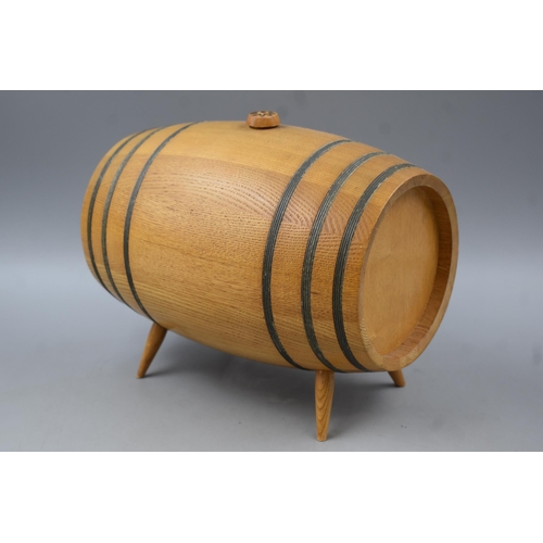 637 - A Small Wooden Whiskey Barrel On Legs, With Carved Designs on the Face. Approx 9