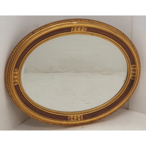 69 - Large Gilt Framed Bevelled Oval Mirror Measures Approx 34 x 26 Inches