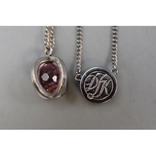 54 - Two Pendant and Chains including Silver