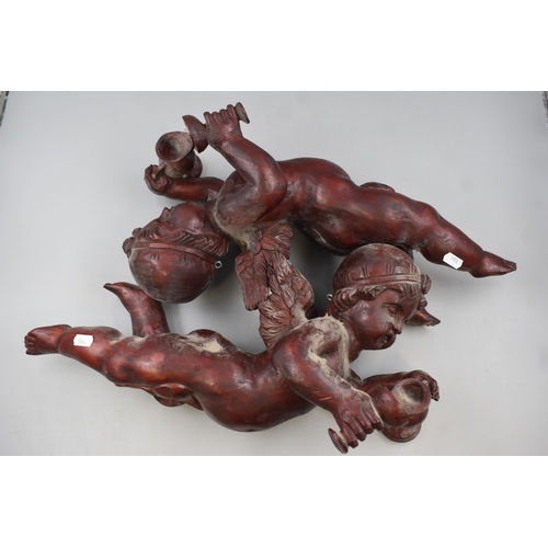 296 - Two Vintage Wooden Carved Cherubs Bacchus.  Approximately 18 Inches In Length. One Has A Broken Wing