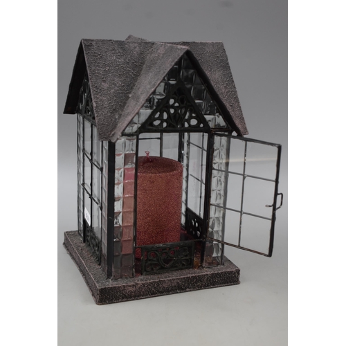 585 - Two Decorative Metal and Glass Garden Lanterns complete with Candles