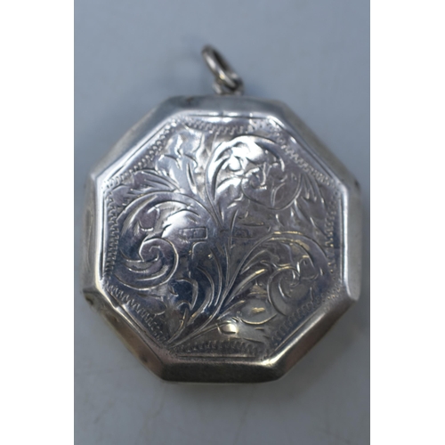 34 - A Hallmarked Silver Octagonal Etched Locket Pendant.