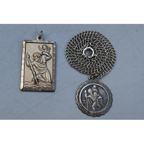 66 - Two Silver St Christopher Pendants