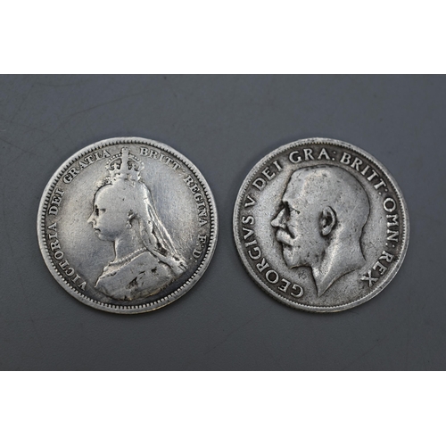 132 - Two Silver British Shillings (1887 and 1915).