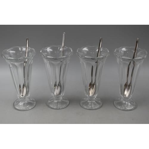 671 - Four Parfait Glasses and a Seven Piece Champagne Flute Set.