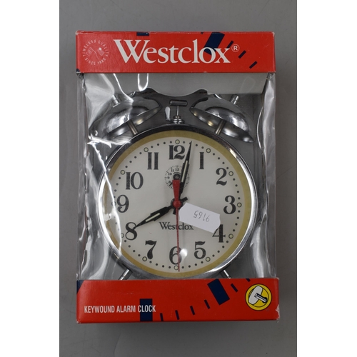 675 - Boxed Westclox Clockwork Alarm Clock and A Wood Framed Quarts Wall Clock Approx 12 Inch Diameter